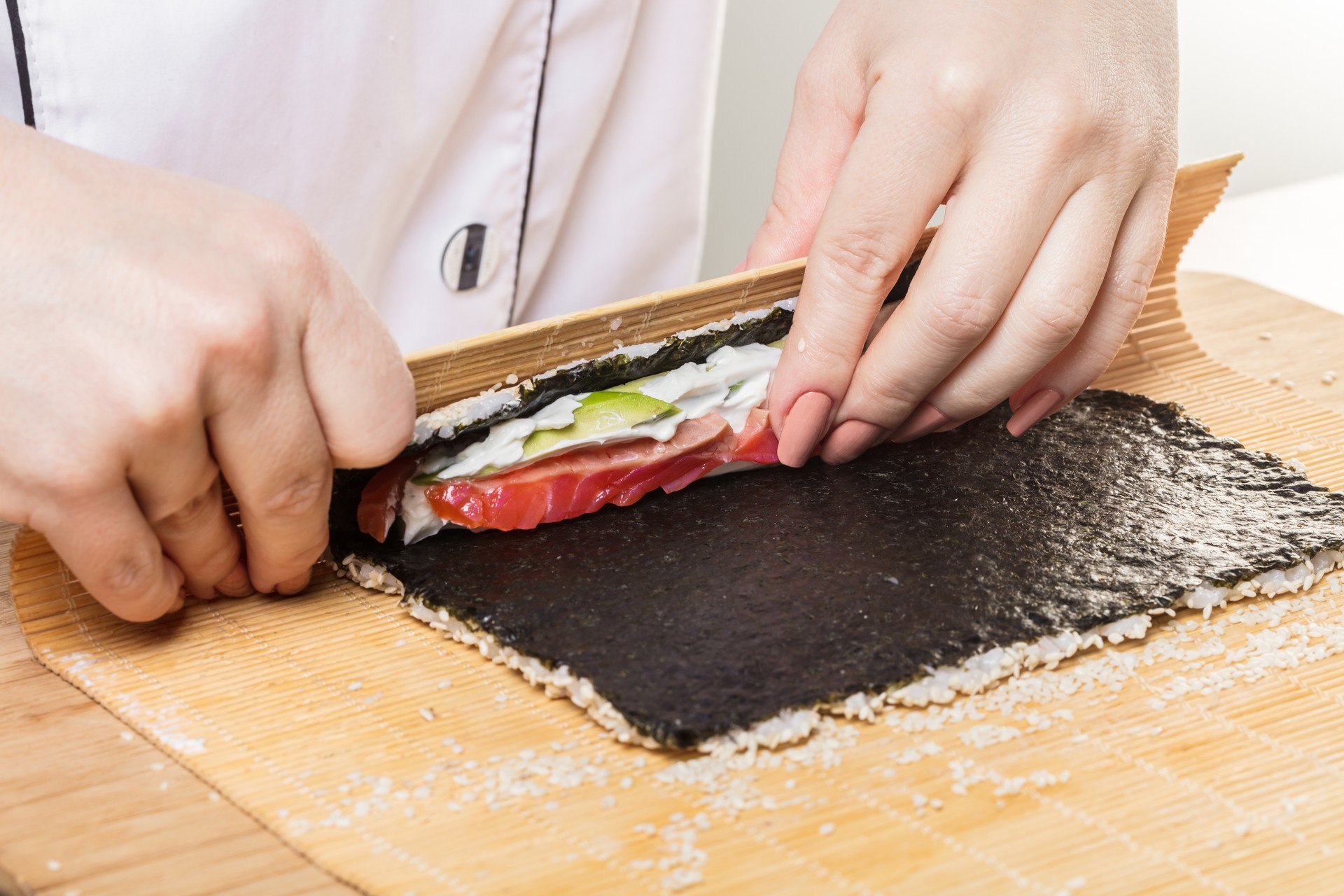 Chef prepares rolls, hands closeup